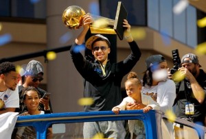 Jun 19, 2015; Oakland, CA, USA; Golden State Warriors guard Stephen Curry holds the the Larry O'Brien Championship Trophy during the Golden State Warriors 2015 championship celebration in downtown Oakland. Mandatory Credit: Cary Edmondson-USA TODAY Sports